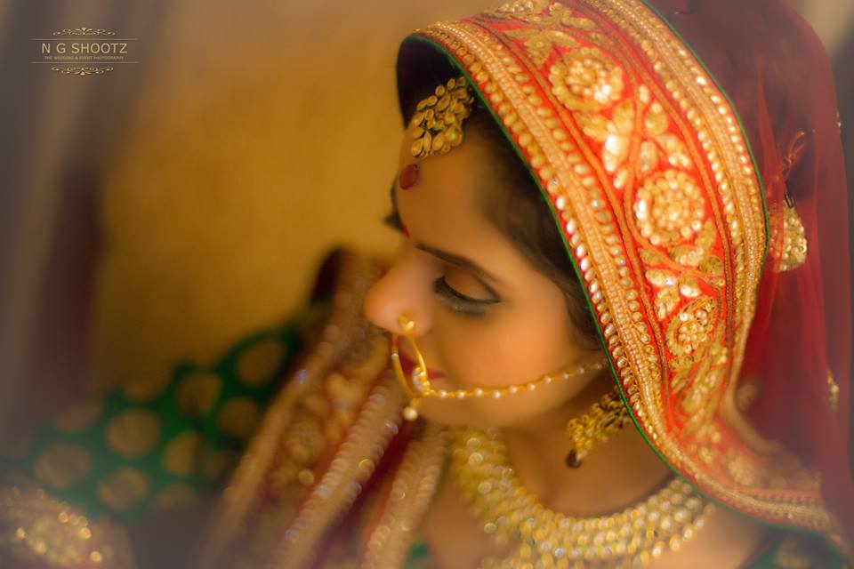 An overhead shot of the bride wearing her elegant maang tikka by NG Shootz Wedding-photography | Weddings Photos & Ideas