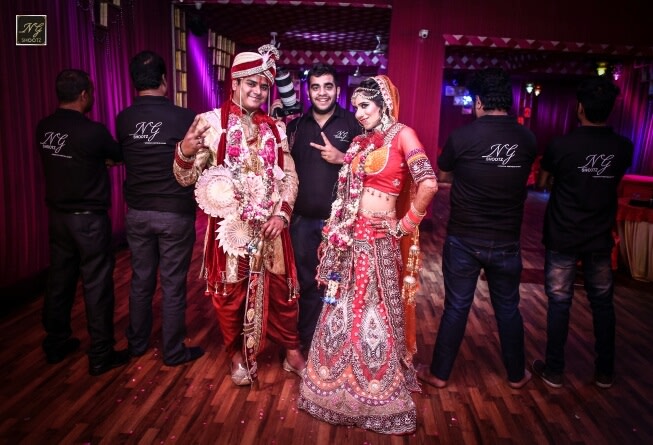 The ecstatic couple posing with the photographer by NG Shootz Wedding-photography | Weddings Photos & Ideas