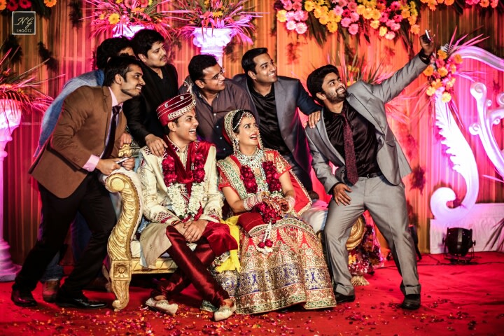 The happy family capturing their memories with a selfie by NG Shootz Wedding-photography | Weddings Photos & Ideas
