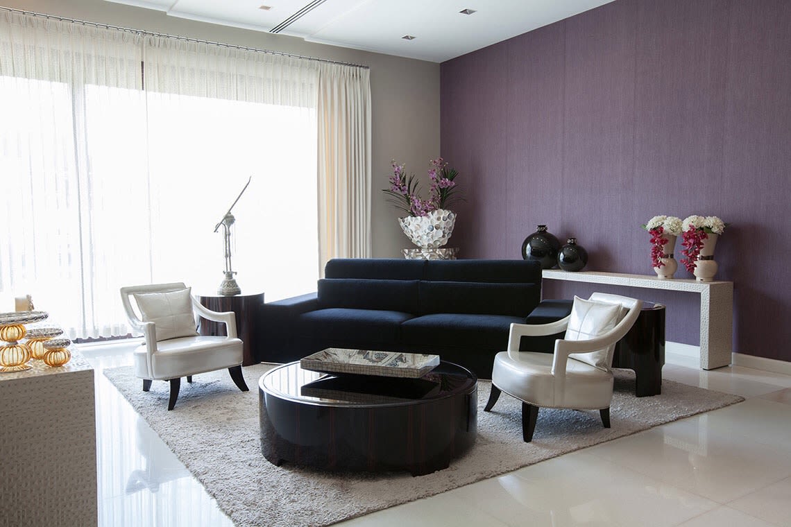 Contrasting Living Room Space With Black Mid-Century Modern Sofa by Sakshi Gugnani Living-room Modern | Interior Design Photos & Ideas