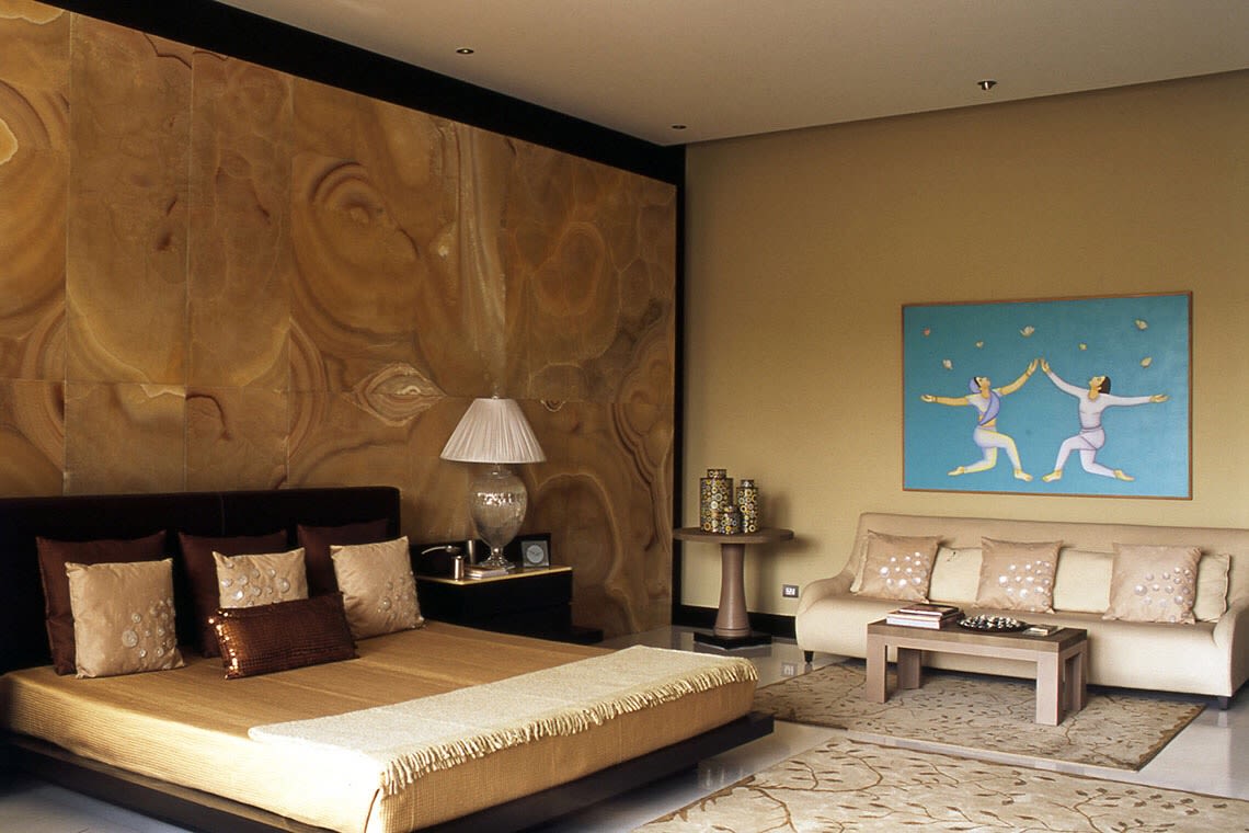 Warm Tone Bedroom Decor With Wooden Low-Floor Bed and Golden Wall Art by Sakshi Gugnani Bedroom Modern | Interior Design Photos & Ideas