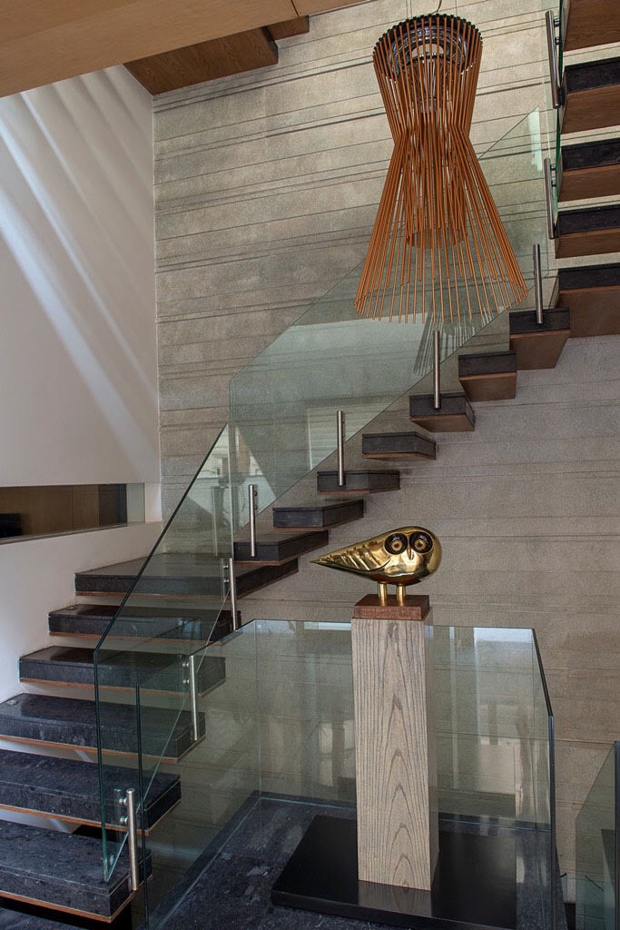 Stairway With Black Granite Floor and Glass Enclosures by Sakshi Gugnani Indoor-spaces Modern | Interior Design Photos & Ideas