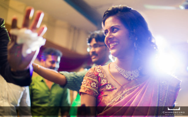A candid picture of the elegant bride smiling by Chiaroscuro Wedding and Art Studio Wedding-photography | Weddings Photos & Ideas
