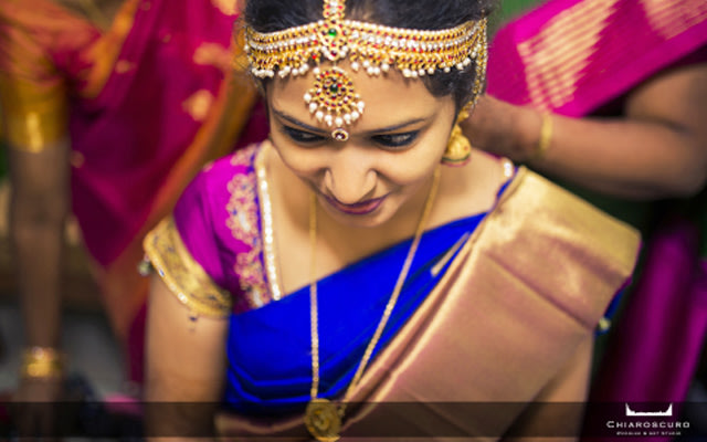 The bride getting all the help she can get to get dressed by Chiaroscuro Wedding and Art Studio Wedding-photography | Weddings Photos & Ideas