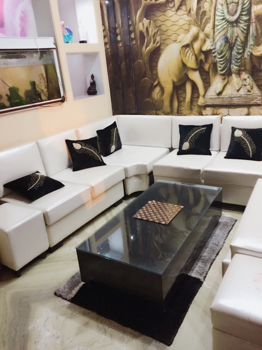 White Cushioned Couch WithGlass Top Centre Table by Vaishali Living-room | Interior Design Photos & Ideas
