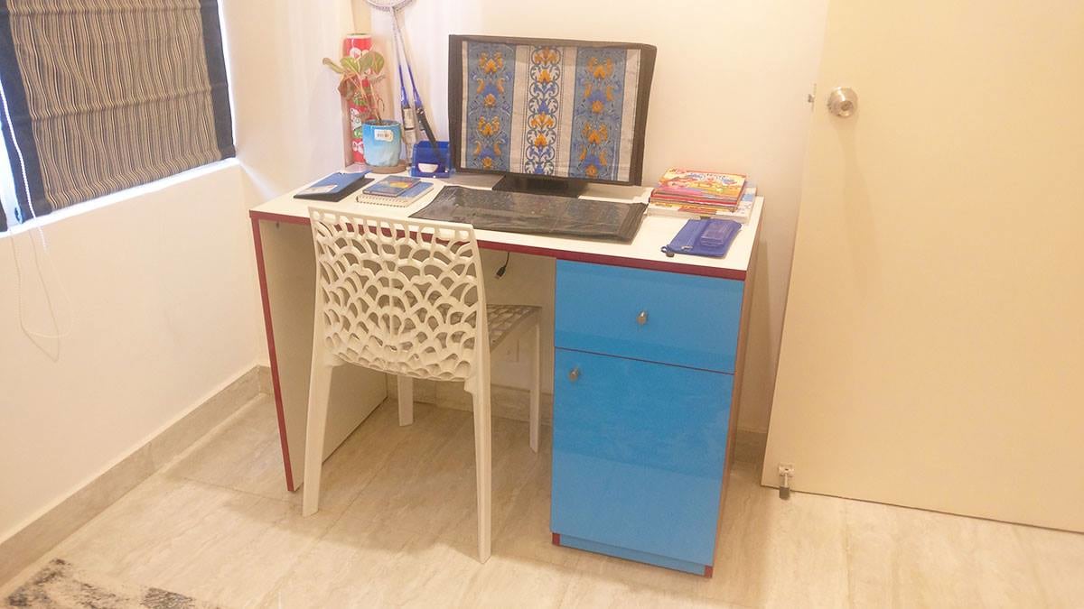 Study table with cream table top and blue base drawers for storage by Interior Wizards Bedroom Contemporary | Interior Design Photos & Ideas