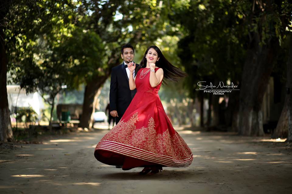 Stunning Red A-Line Gown With Golden Border Lines And Prints by Sourab Sharma Wedding-photography Wedding-dresses | Weddings Photos & Ideas
