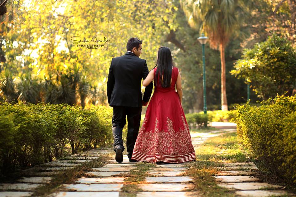 Back Shot Of The Couple Taking A Brisk Walk In A Park by Sourab Sharma Wedding-photography | Weddings Photos & Ideas