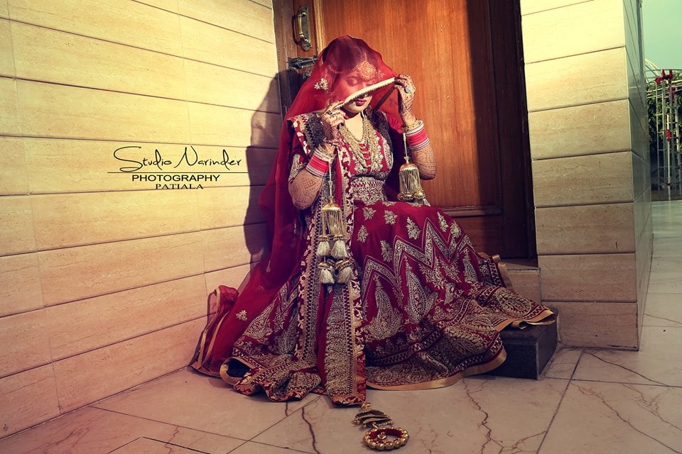 Regal Cherry Red Lehenga With Detailed Golden Motifs by Sourab Sharma Wedding-photography Wedding-dresses | Weddings Photos & Ideas