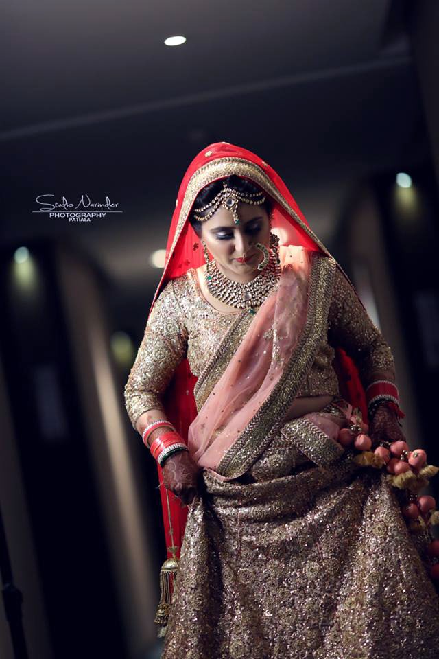 Shimmering Golden Lehenga With Soft Pink Chunni Completing Its Look With Red Veil by Sourab Sharma Wedding-photography Wedding-dresses | Weddings Photos & Ideas