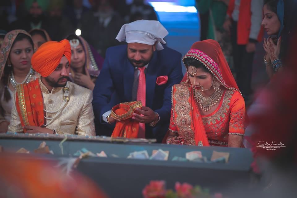 Candid Shot Sikh Of Bride And Groom Amidst Tying A Knot by Sourab Sharma Wedding-photography | Weddings Photos & Ideas
