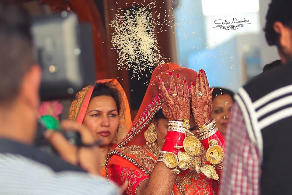 Captivating Glimpse of Bride Performing A Ritual During Vidai by Sourab Sharma Wedding-photography | Weddings Photos & Ideas