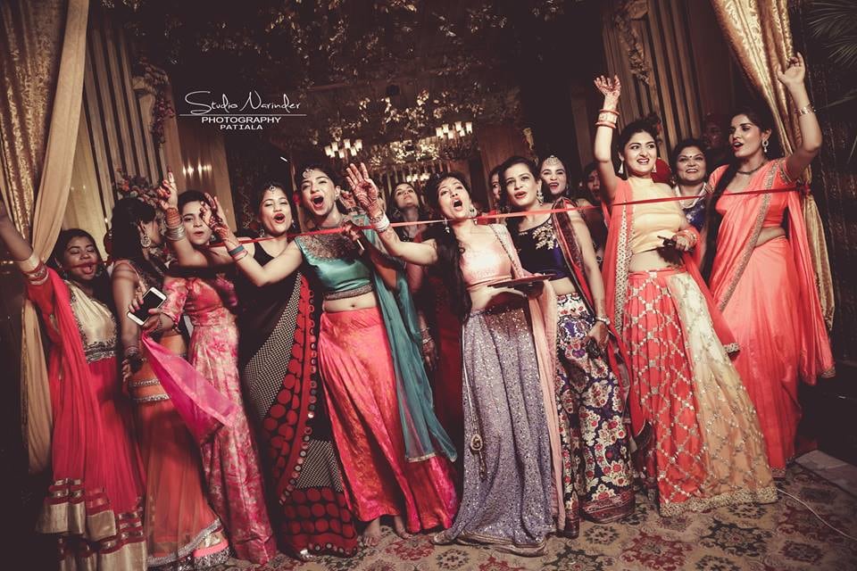 Candid Shot Of Bridesmaids During Ribbon Cutting Ceremony by Sourab Sharma Wedding-photography | Weddings Photos & Ideas