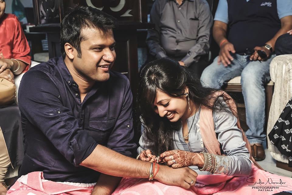 Beautiful Capture Of Bride And Groom Amidst A Ritual On Engagement Day by Sourab Sharma Wedding-photography | Weddings Photos & Ideas