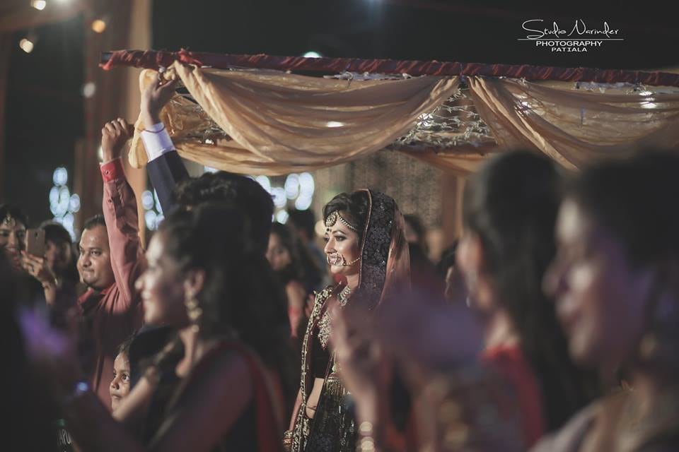Candid Shot Of Bride Walking Down the Aisle Under Phool Chadar by Sourab Sharma Wedding-photography | Weddings Photos & Ideas