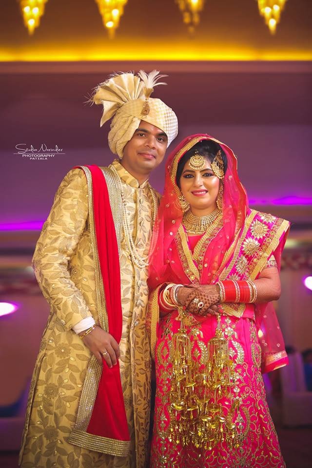 Pink Bridal Lehenga With Golden Patch Work And Off-White Sherwani With Leaf Prints And Red Stole by Sourab Sharma Wedding-photography | Weddings Photos & Ideas