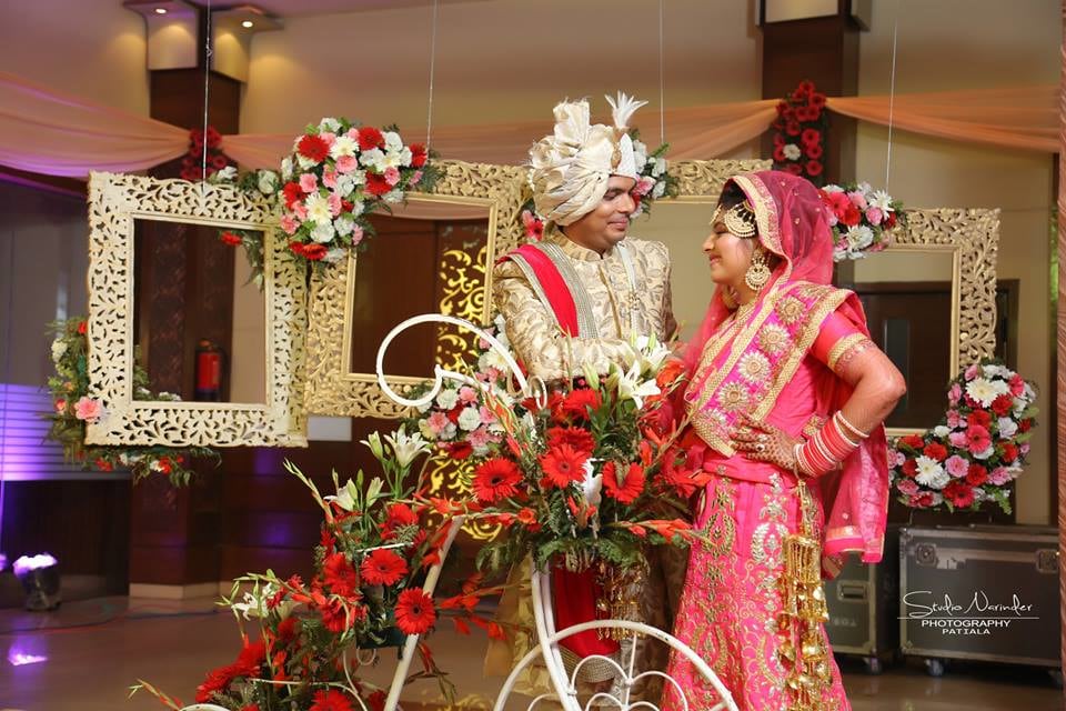 Wedding Shoot Of Bride And Groom In A Flowery Decoration Using Props Like Frames And Bicycle by Sourab Sharma Wedding-photography | Weddings Photos & Ideas