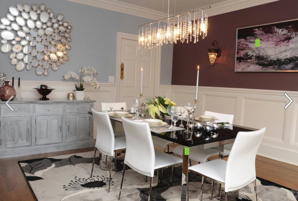 Luxurious dining room setting and granite table top and white chair lit by hanging lights by Tanya Anand Dining-room Modern | Interior Design Photos & Ideas