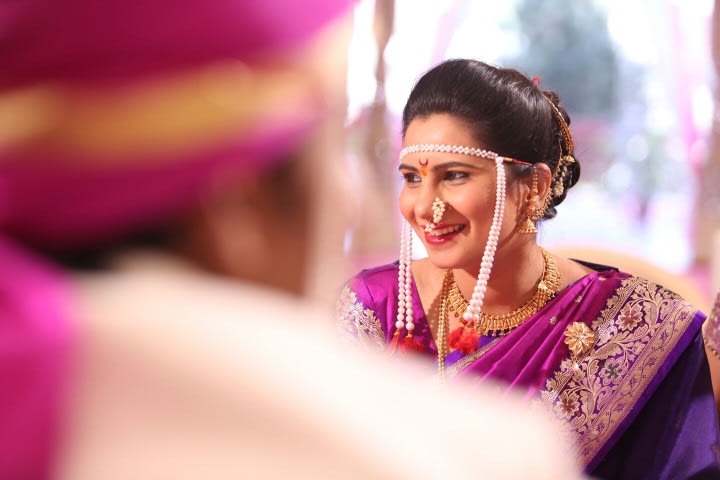 Candid Dhot Of Marathi Bride Highlighting Her Conventional Marathi Headpiece And Nath by Sameer Panchpor Wedding-photography | Weddings Photos & Ideas