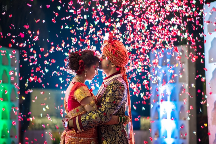 Enthralling Glimpse Of Bride And Groom Being Showered By Rose Petals by Sameer Panchpor Wedding-photography | Weddings Photos & Ideas
