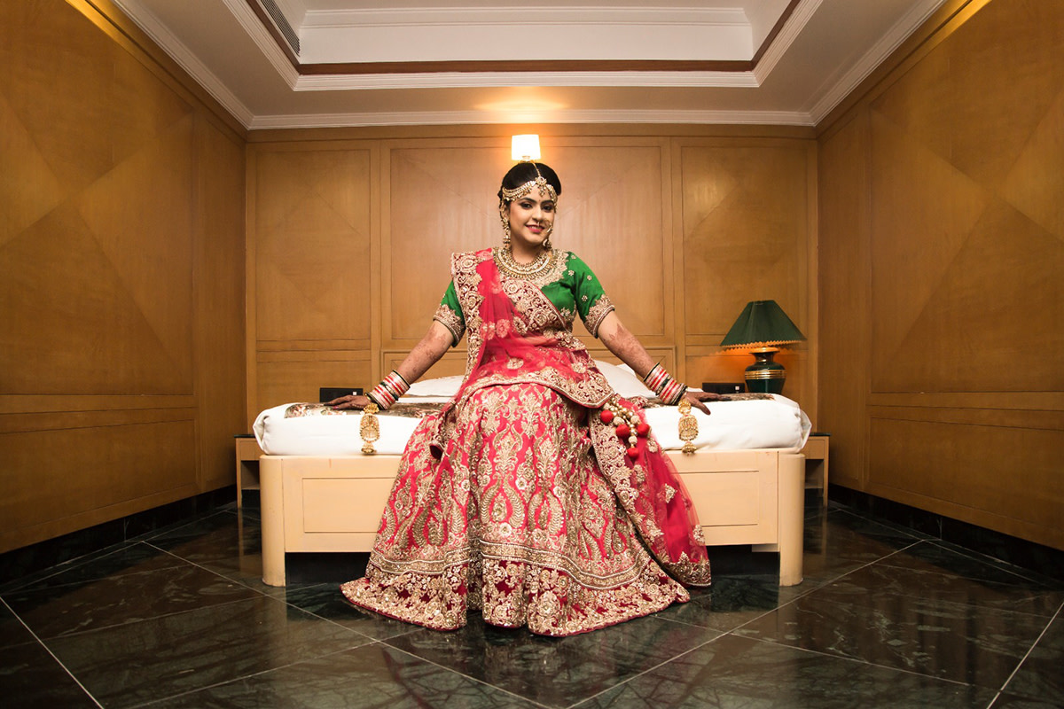 Stunning Red Bridal Lehenga With Golden Motifs And Green Blouse For A Conventional Bridal Look by Nikhil Y. Bharane Wedding-photography Wedding-dresses | Weddings Photos & Ideas