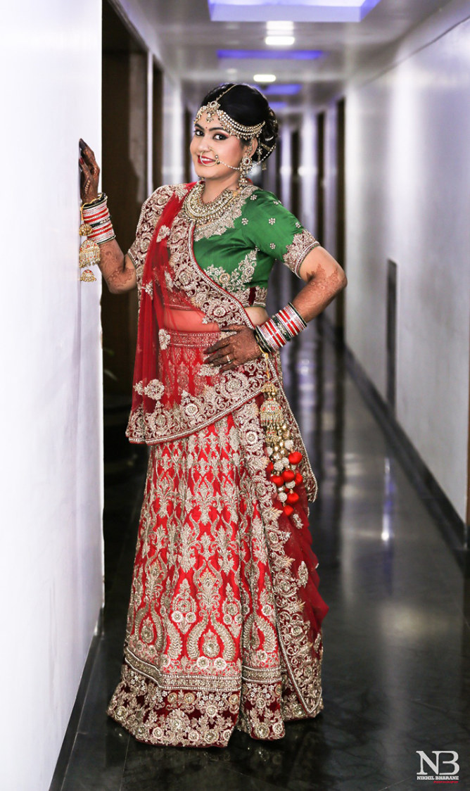 Cherry Red Lehenga Embellished With Heavy Silver Zardozi Work And Green Choli And Garmet Red Net Dupatta by Nikhil Y. Bharane Wedding-photography Wedding-dresses | Weddings Photos & Ideas