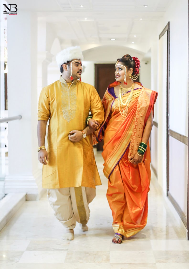 Yellow Kurta And Dhoti With Golden Work On Collar Neck For Groom And Orange Silken Saree With Golden Borders For Bride by Nikhil Y. Bharane Wedding-photography Groom-wear-and-accessories | Weddings Photos & Ideas