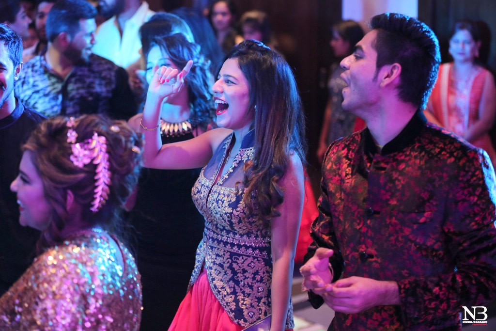 Candid Shot Of Wedding Guests Swaying On The Dance Floor by Nikhil Y. Bharane Wedding-photography | Weddings Photos & Ideas