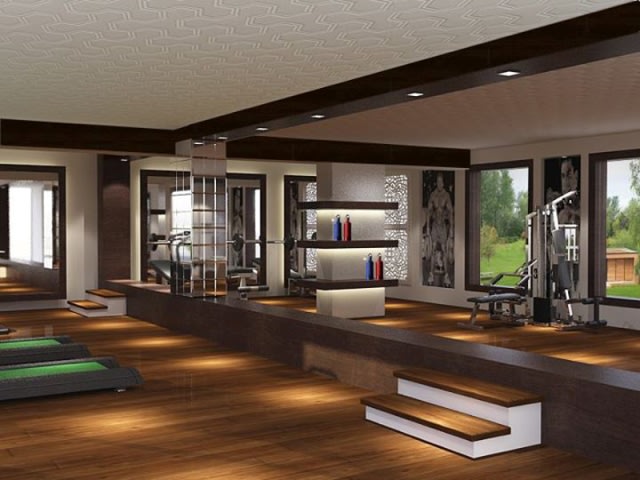 Spacious home gym with wooden flooring by SA Design Group Modern | Interior Design Photos & Ideas