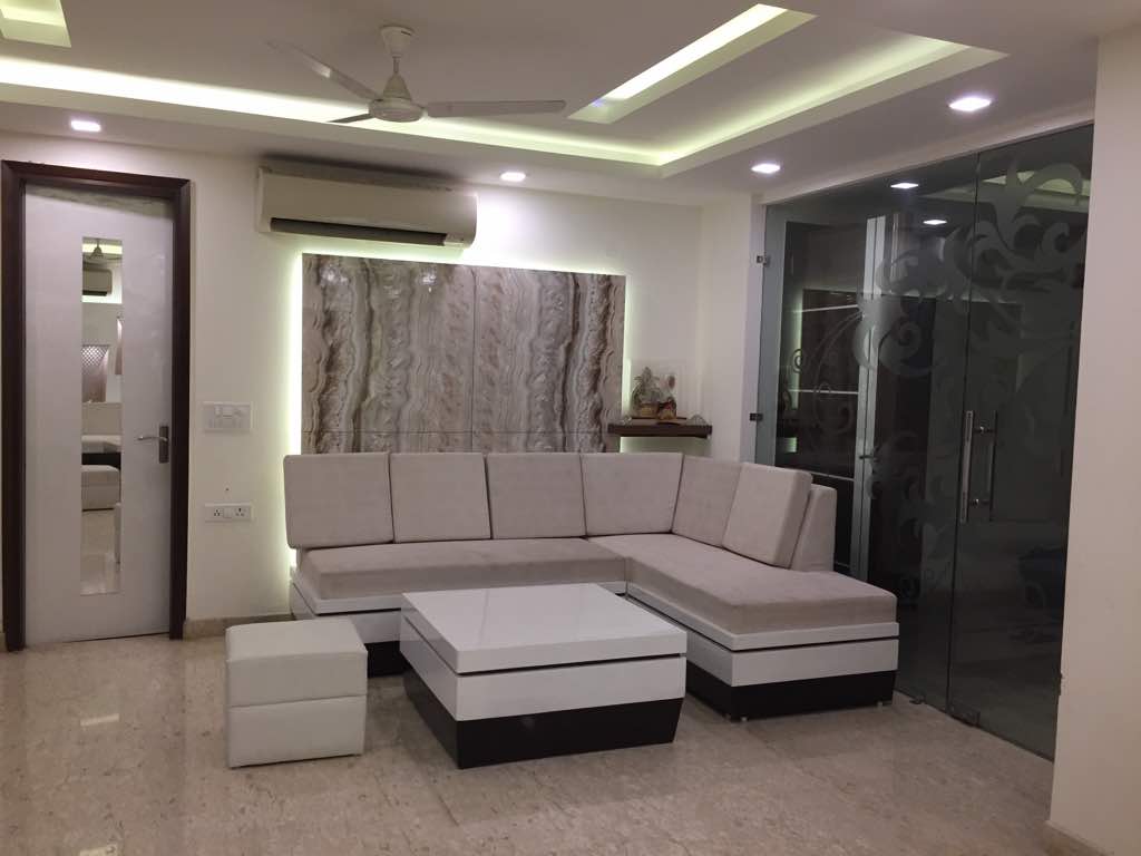 Square Shape Center Table With L-Shaped Sofa In Living Room by Amit Sharma Living-room Minimalistic | Interior Design Photos & Ideas