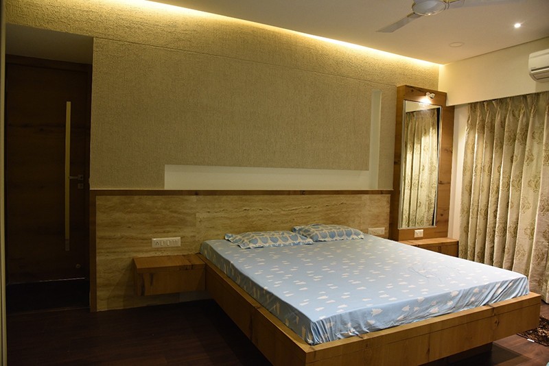 Wooden Low Rise Bed With Textured Walls by Ankil Desai Bedroom Modern | Interior Design Photos & Ideas