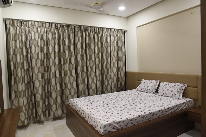 Queen Size Bed With Patterned Curtains For Bedroom Space by Ankil Desai Bedroom Modern | Interior Design Photos & Ideas