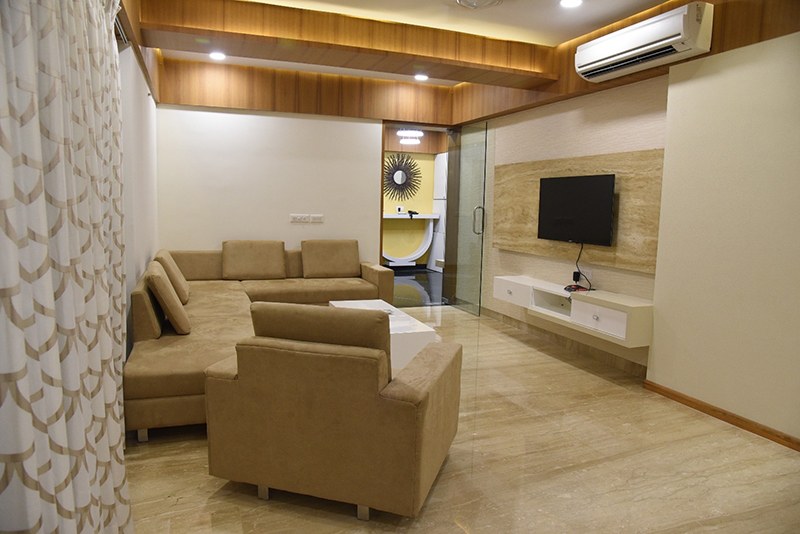 Tan Colored Sectional Sofa With Marbel Flooring by Ankil Desai Living-room Modern | Interior Design Photos & Ideas