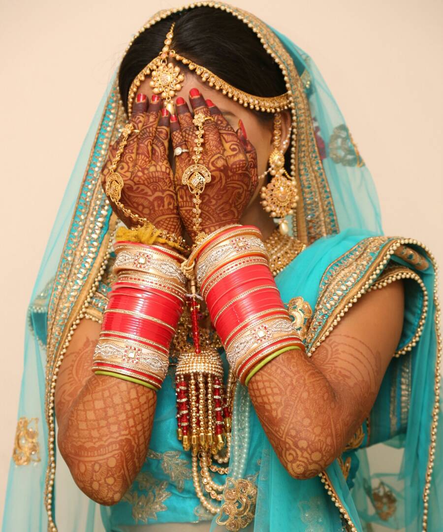 Shy bride showing off her exquisite mehandi by Proffesional Photographer Wedding-photography | Weddings Photos & Ideas