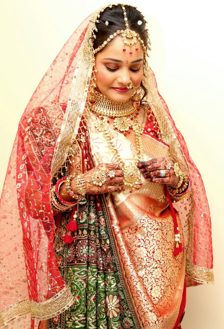 The bride admiring her gold jewellery by Proffesional Photographer Wedding-photography | Weddings Photos & Ideas
