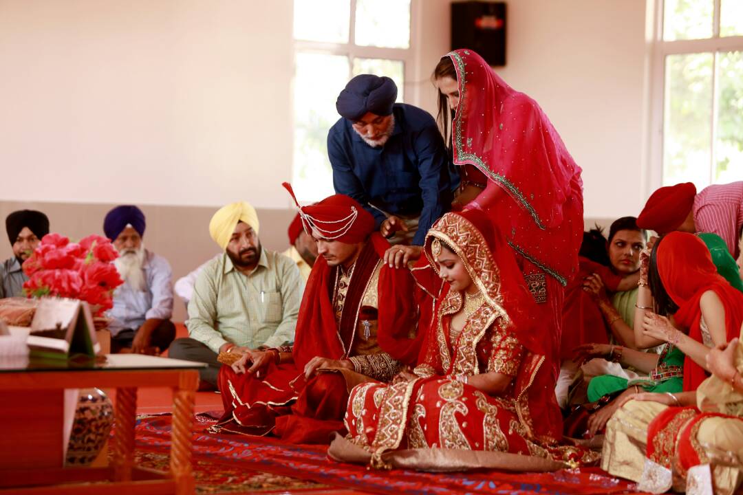 The bride and groom receiving their blessings by Proffesional Photographer Wedding-photography | Weddings Photos & Ideas
