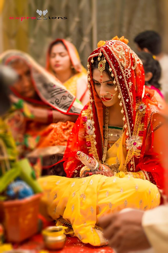 Bride looking pretty in her red dress by Exprezzions Wedding-photography | Weddings Photos & Ideas