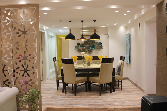 Neutral Tone Dining Room With Beige Cushioned Side Chairs by Shikhar Gupta Dining-room Modern | Interior Design Photos & Ideas