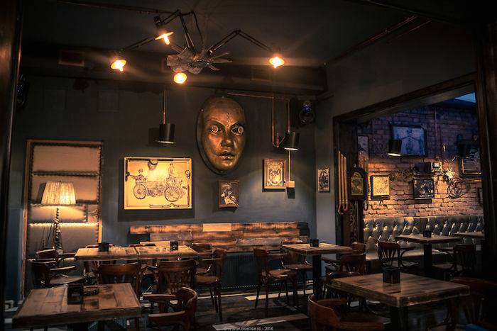 Vintage Wooden Finished Restaurant with Artistic Display Unit by The Work-Worm Architects Vintage | Interior Design Photos & Ideas