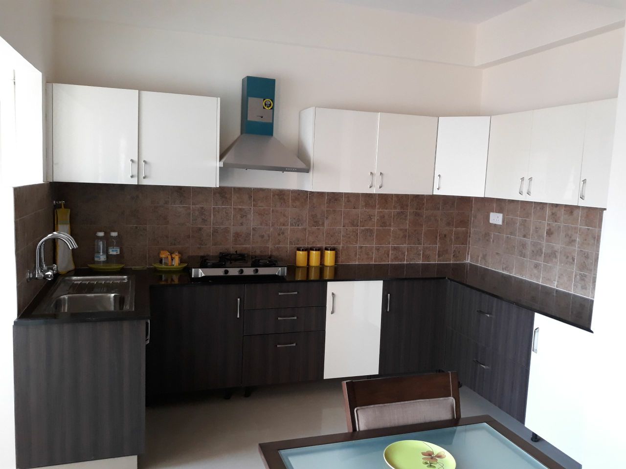 Black And White Modular Kitchen by Rashmi