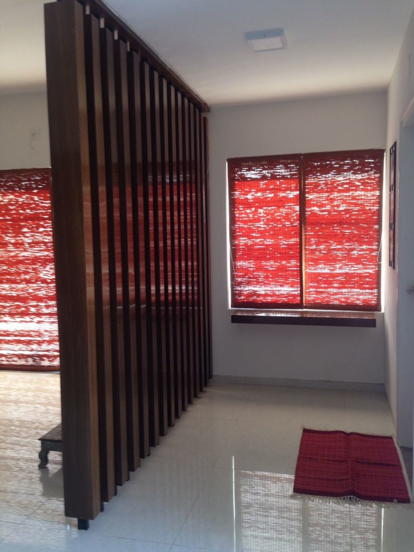 Hallway With Wooden Partition by Aanoshka Choksi Indoor-spaces Contemporary | Interior Design Photos & Ideas