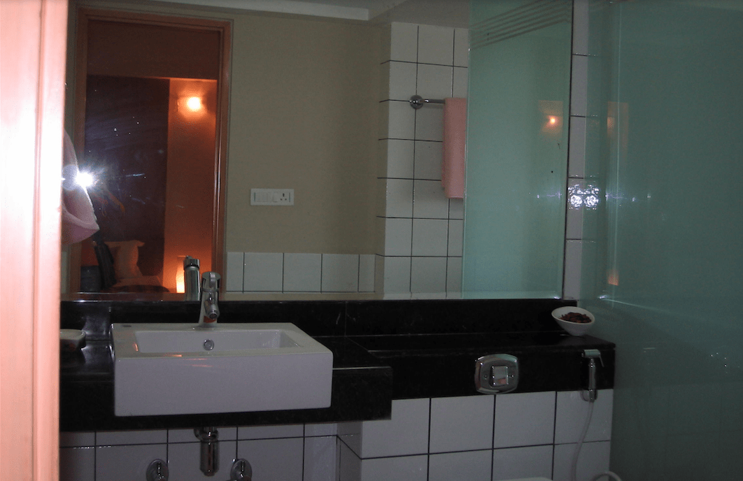 Bathroom With White Tiles And Large Mirror by INV Home Bathroom Contemporary | Interior Design Photos & Ideas