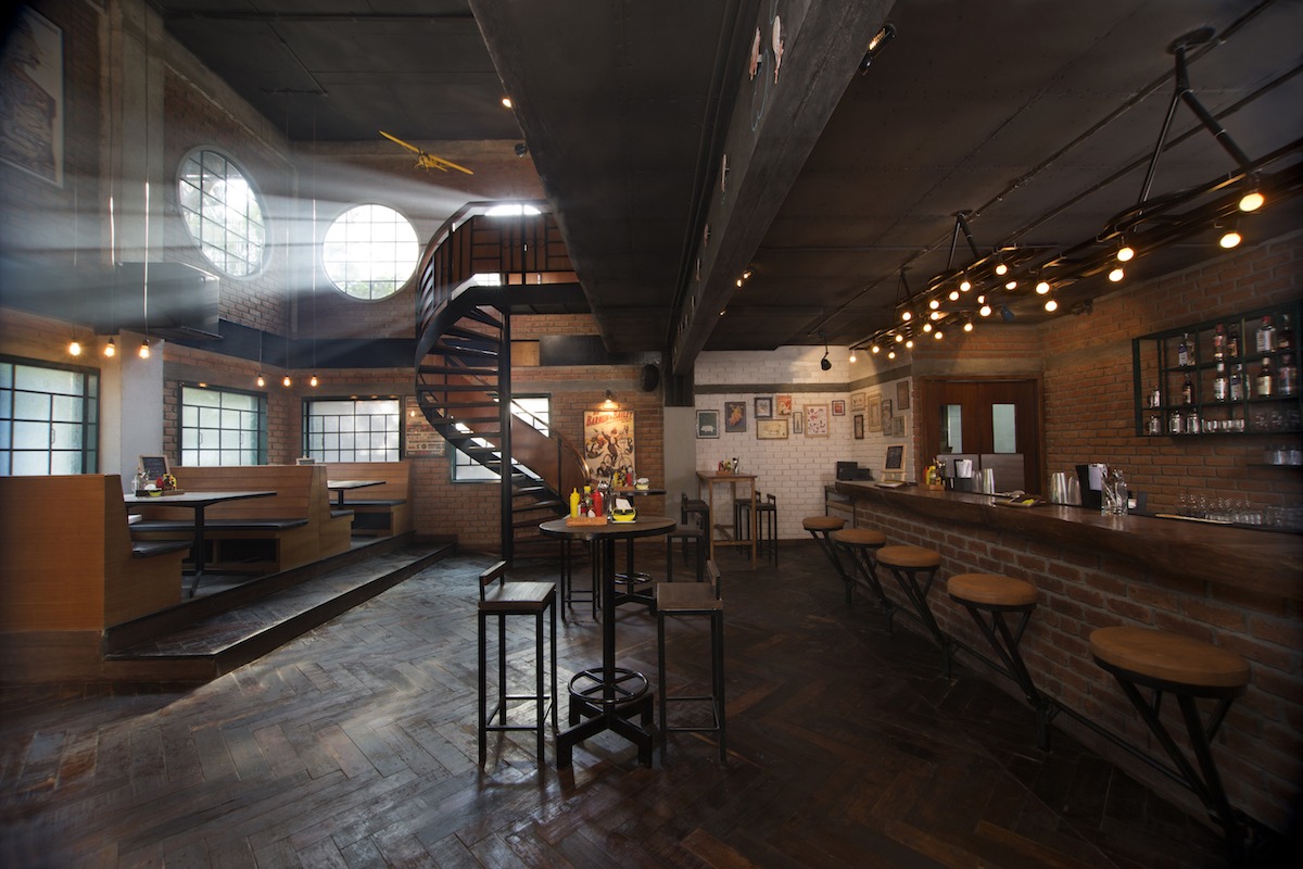 Restaurant With Dark Wooden Flooring And Interiors And Dim Lighting by Jatin Hukkeri Contemporary | Interior Design Photos & Ideas