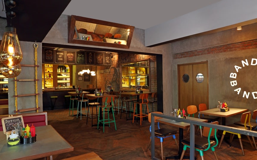 Cafe With Wooden Flooring And Colorful Chairs by Jatin Hukkeri Eclectic | Interior Design Photos & Ideas