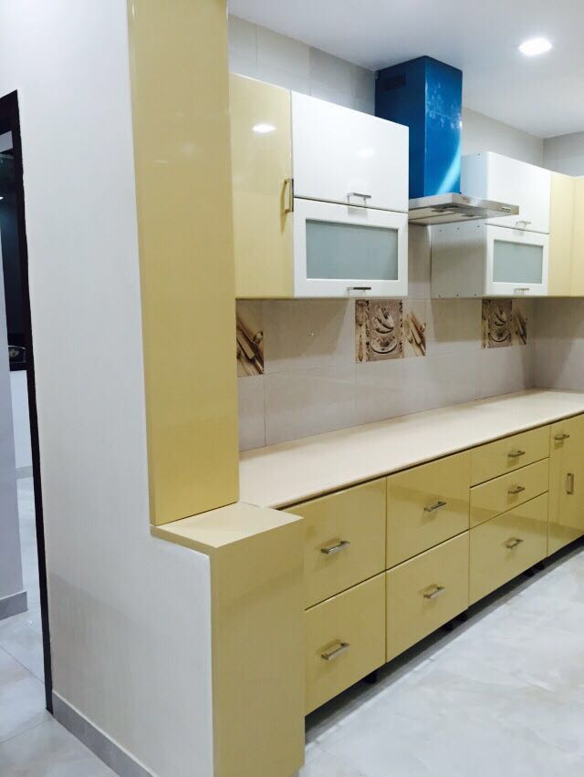 Parallel Kitchen With Pale Yellow Cabinets by Arpit Khurana Contemporary | Interior Design Photos & Ideas