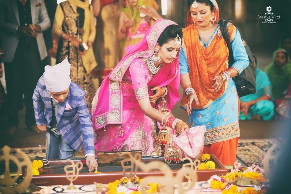 A Beautiful Bride Performing a Ritual. by Vinny Virdi Photography Wedding-photography Wedding-dresses | Weddings Photos & Ideas