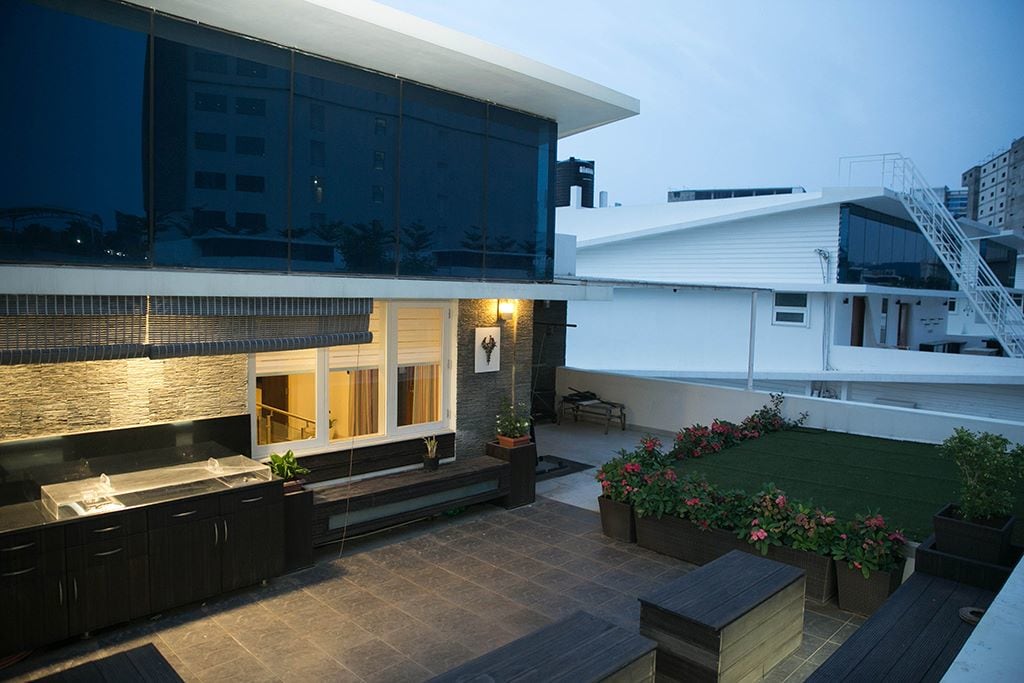 Wooden Seating Area And Flooring In A Modern Balcony by Kv Patel Open-spaces Contemporary | Interior Design Photos & Ideas