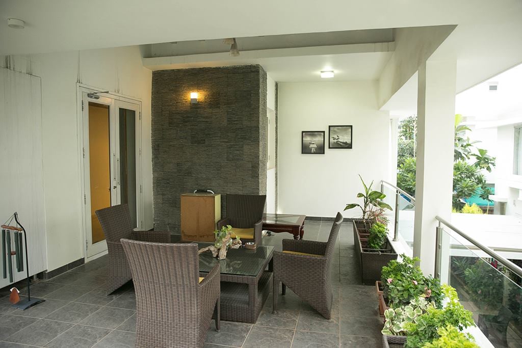 Patio Chairs And Glass Table In A Modern Balcony by Kv Patel Open-spaces Contemporary | Interior Design Photos & Ideas