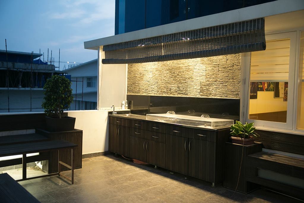 Balcony With Wooden Flooring And Dark Brown Cabinets by Kv Patel Open-spaces Contemporary | Interior Design Photos & Ideas