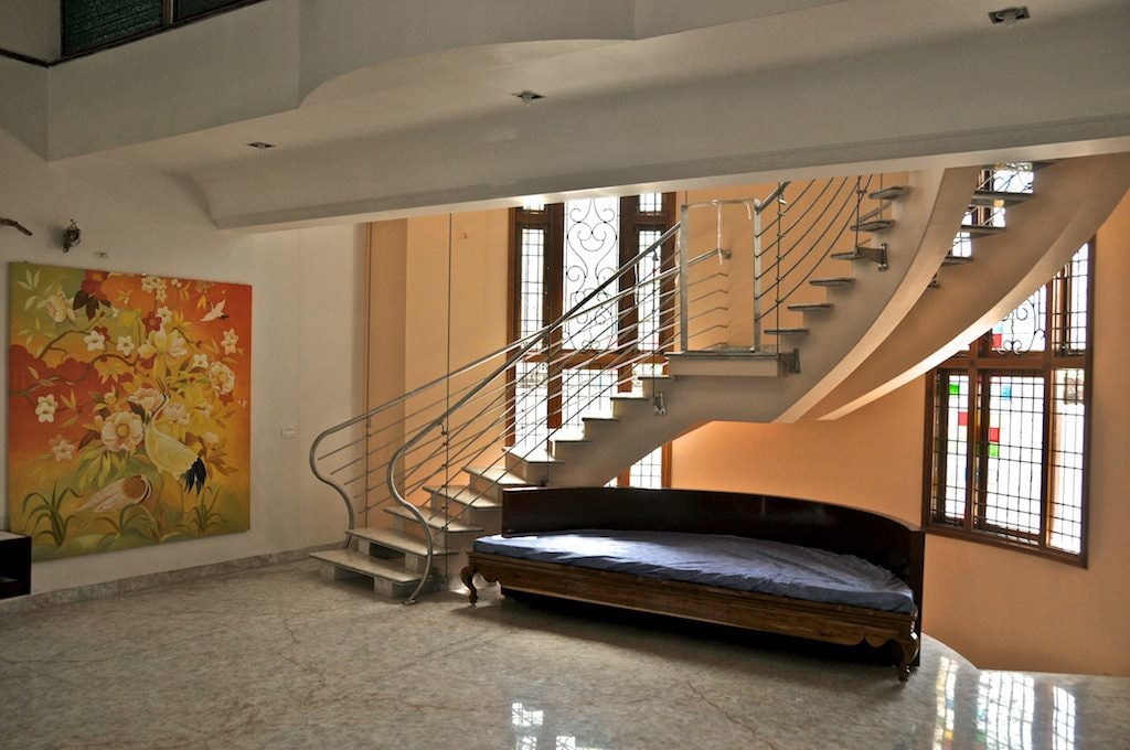 Round Staircase with Marble Flooring and Wall Art by Viraf Laskari Indoor-spaces Minimalistic | Interior Design Photos & Ideas